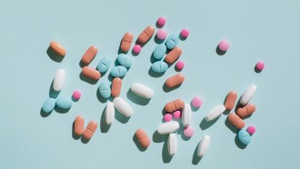 A bunch of pills on a blue background
