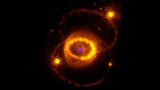 This false-color composite space image shows a bright ring of swirling dust and gas around a bright blue spot, both remnants of the supernova explosion dubbed 1987A. The blue spot marks an area of highly ionized atoms, as seen by the James Webb Space Telescope, suggesting the explosion left behind some kind of neutron star.