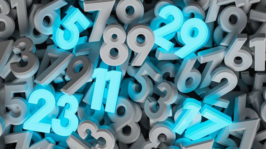 An image of grey numbers piled on top of each other. All numbers are grey except for the visible prime numbers of 5, 11, 17, 23 and 29, which are highlighted blue.