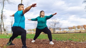 Two people exercising outside